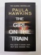 Paula Hawkins: The Girl On The Train Měkká (2016 černá)